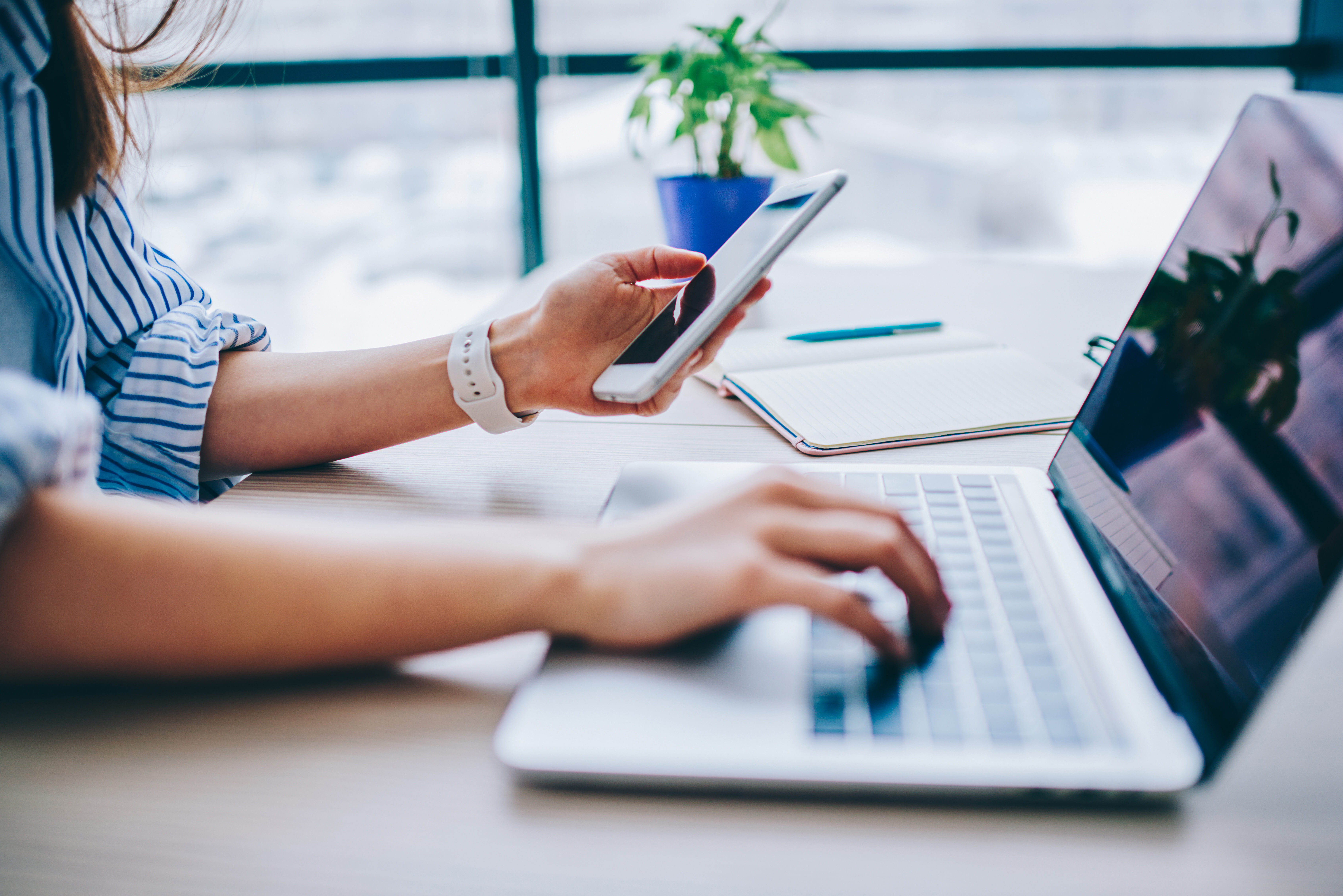 Woman on computer and phone